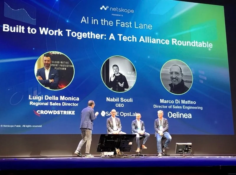 Nabil Souli, CEO of SASE OpsLab, on stage with CrowdStrike and Delinea at Netskope AI in the Fast Lane in Reggio Emilia